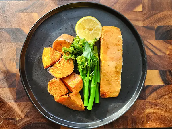 Baked salmon with sweet potatoes and tenderstem broccoli