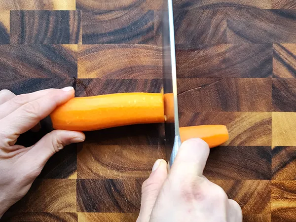 Cutting a carrot with a knife
