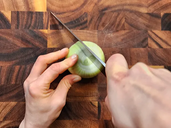 Cutting onion in half