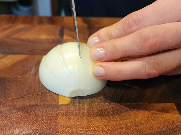 Medium dicing an onion