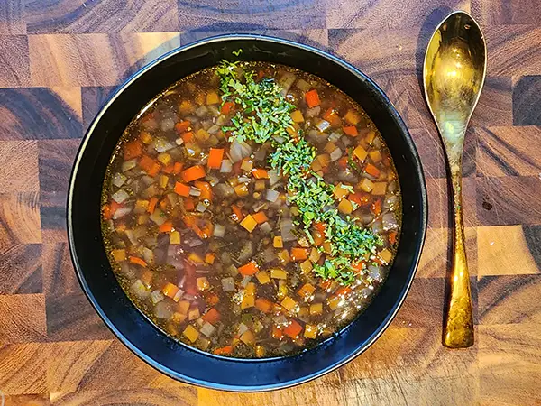Black lentil soup in the plate