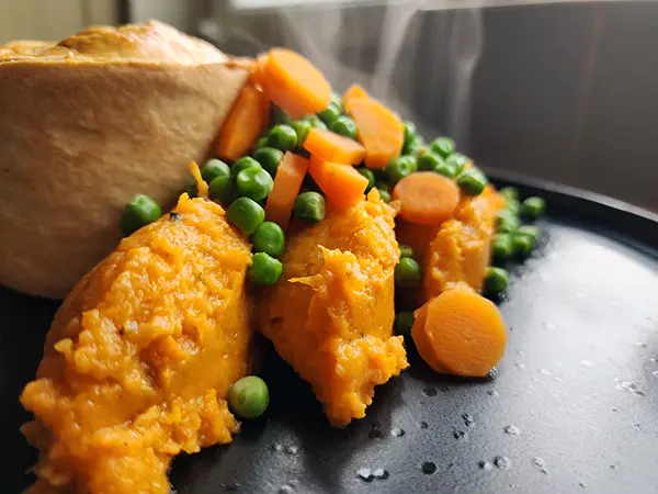 Healthy Chicken Mushroom And Leek Pie With Mash, Carrots, And Peas