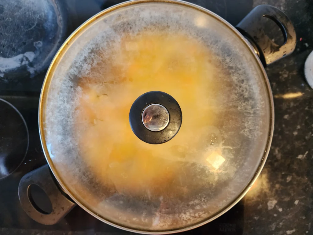 Simmering chicken plov